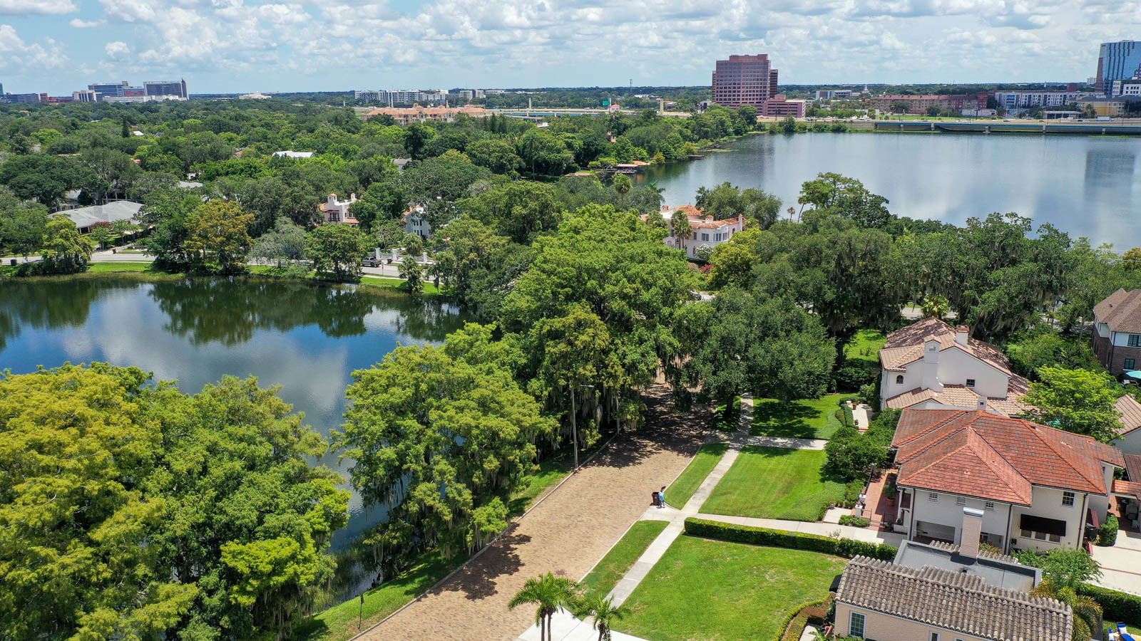 drone shot of college park homes and lake