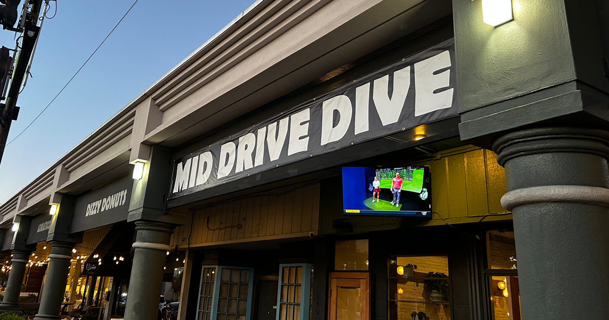 Illuminated Mid Drive Dive sign outside of building, located in College Park, Orlando